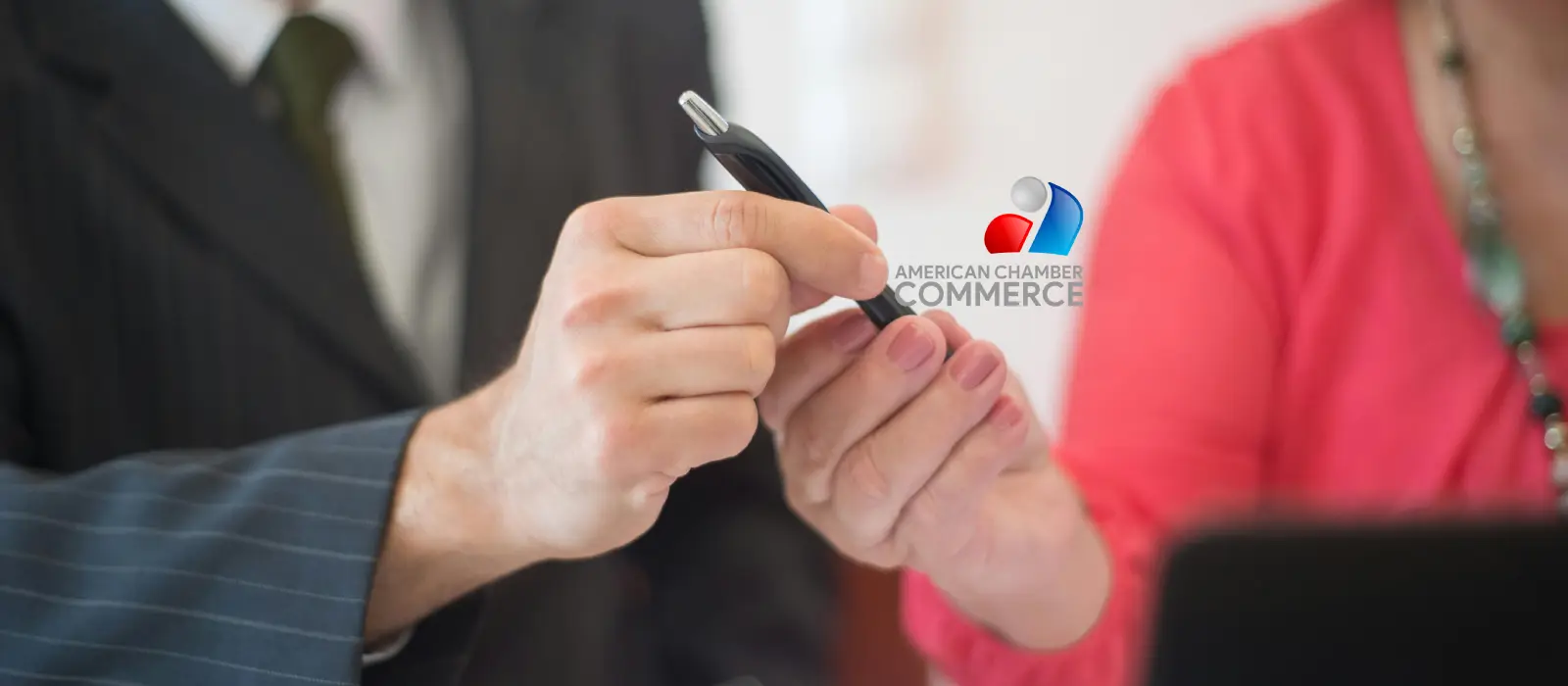 Business colleagues reviewing information on a phone