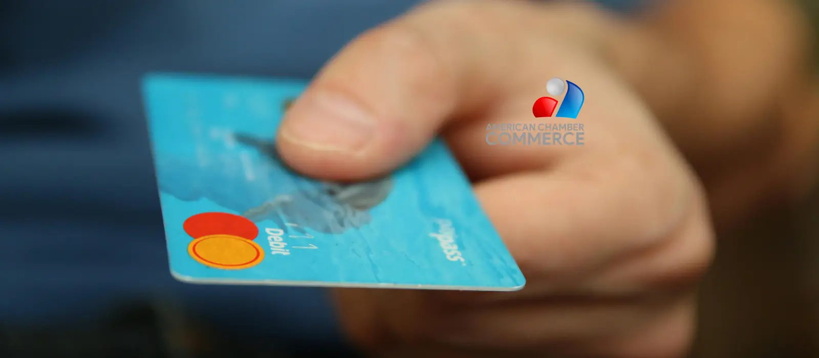 Person holding a payment card